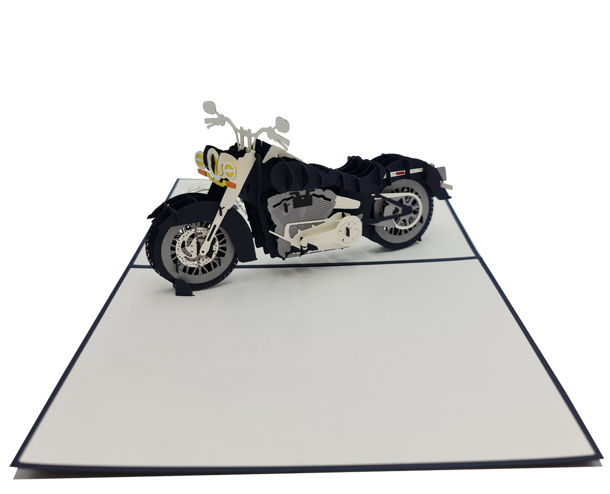 Aufgeklappte Pop-up-Karte mit einem schwarz-cremefarbenen Chopper-Motorrad aus Papier.