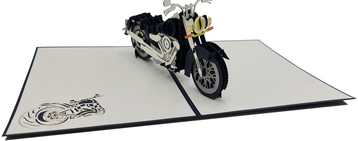 Aufgeklappte Pop-up-Karte mit Chopper-Motorrad, von schräg oben fotografiert.