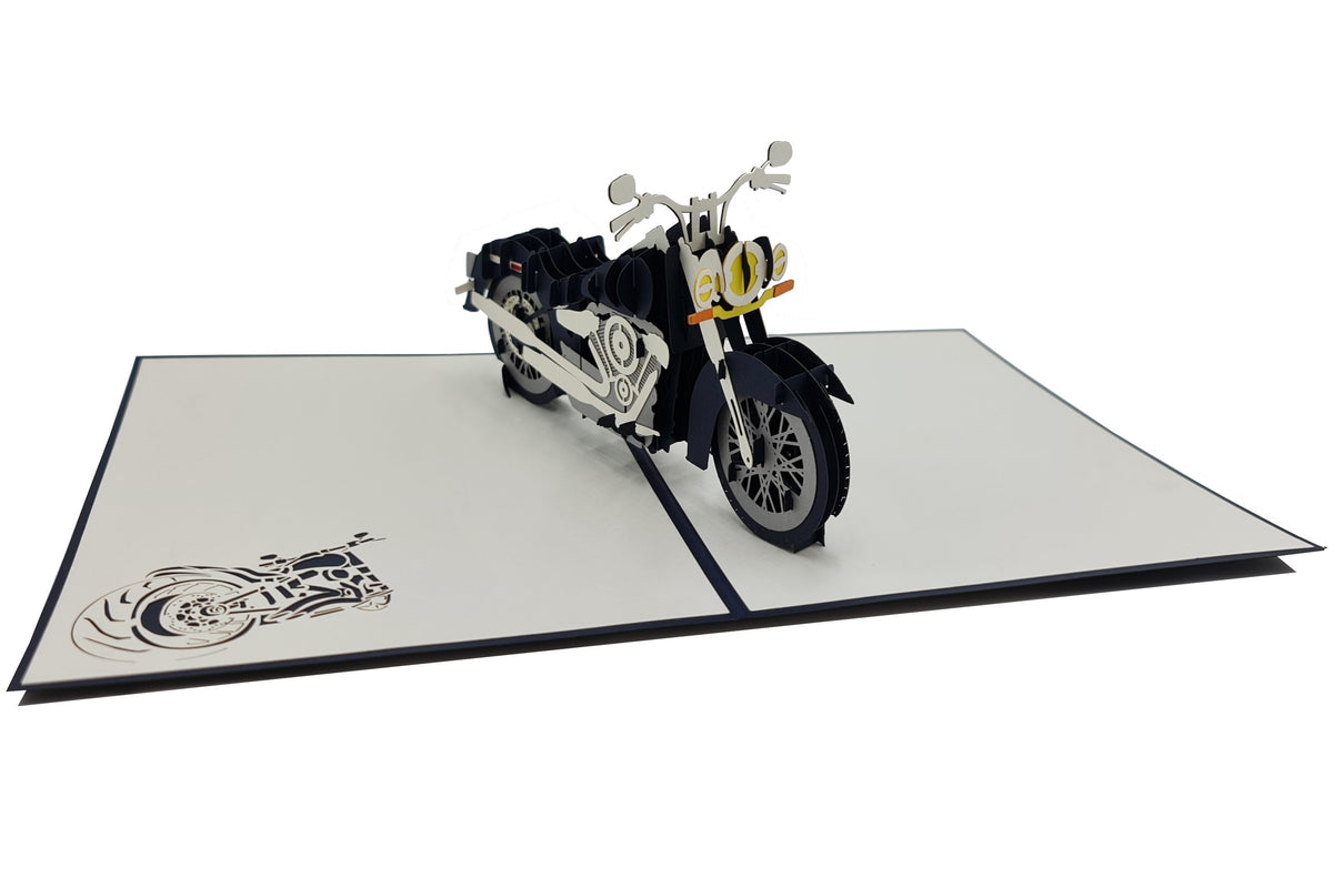 Aufgeklappte Pop-up-Karte mit Chopper-Motorrad, von schräg oben fotografiert.