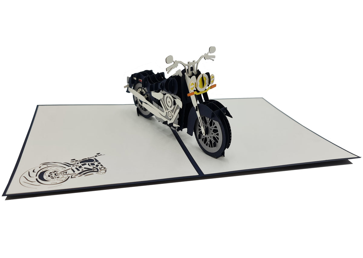 Aufgeklappte Pop-up-Karte mit Chopper-Motorrad, von schräg oben fotografiert.