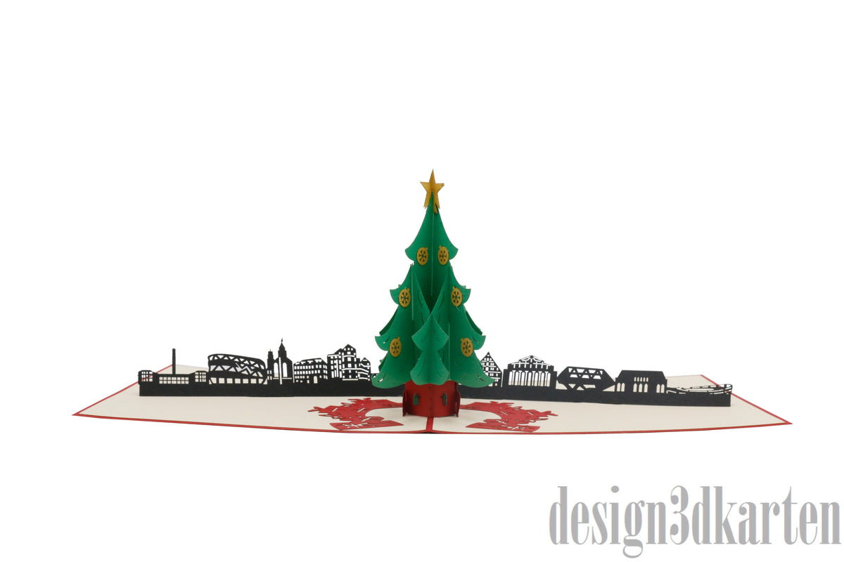Aufgeklappte Pop-up-Karte mit grünem Weihnachtsbaum vor der Skyline von Stuttgart.