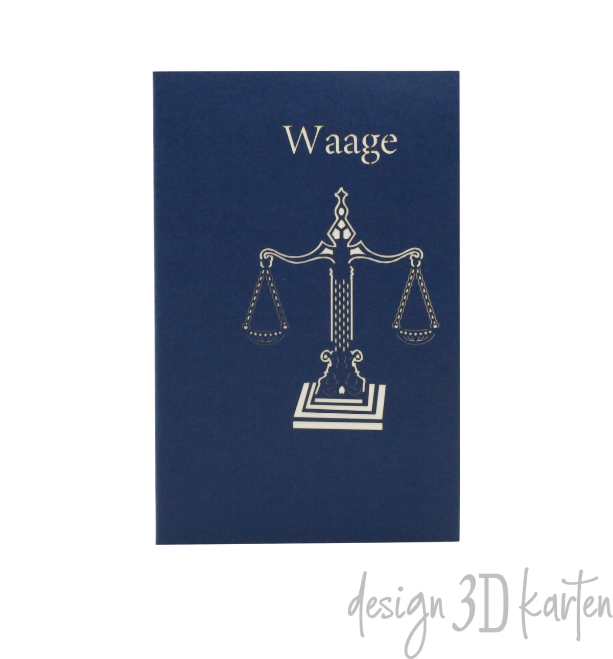 Dunkelblaue Kartenvorderseite mit einer Waage als Scherenschnitt und dem Schriftzug Waage.