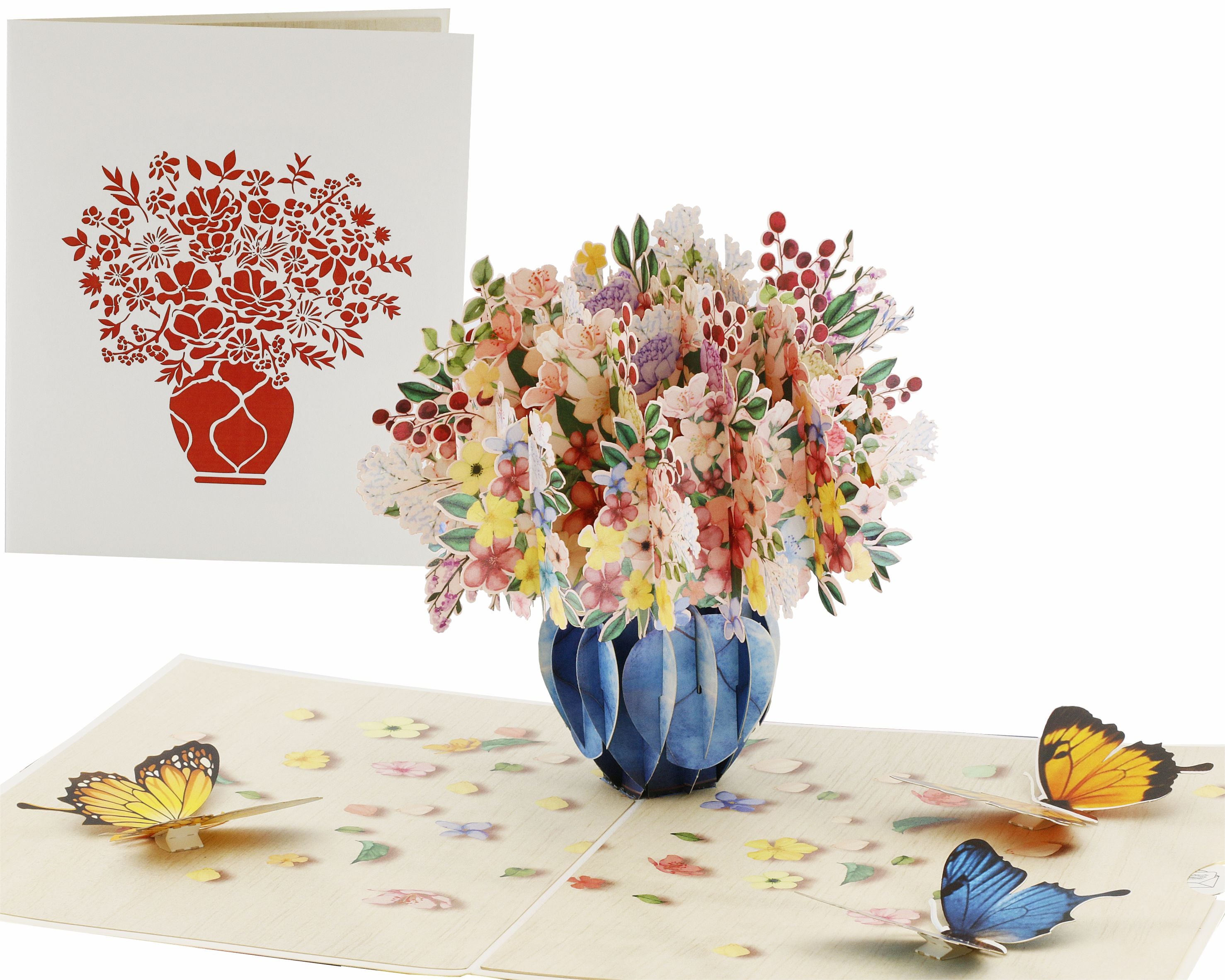 Aufgeklappte Pop-up-Karte mit einem bunten Blumenstrauß in blauer Vase und Schmetterlingen, daneben die weiße Kartenvorderseite mit Blumenstrauß-Scherenschnitt.