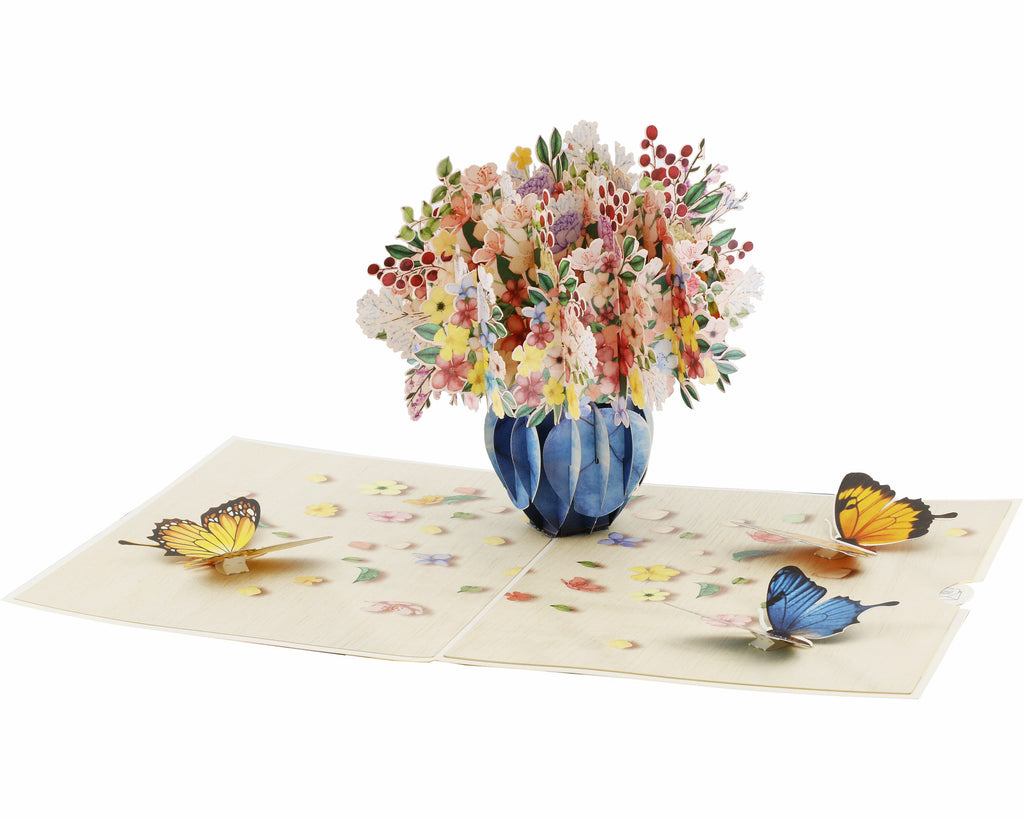 pop up karte mit buntem blumenstrauß in der vase, mit blauen und gelben schmetterlingen