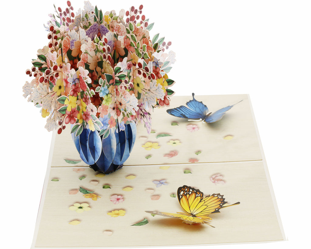 pop up karte mit buntem blumenstrauß in der vase, mit blauen und gelben schmetterlingen