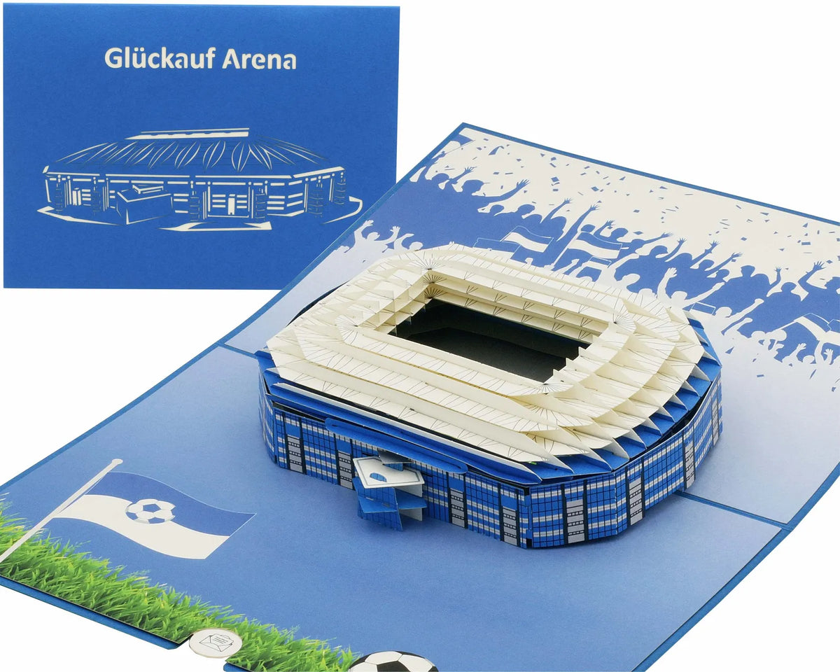 Pop-up Karte mit einem Stadionmodell und blauer Klappkarte mit dem Schriftzug Glück auf Arena, ideal für Fußballfans und als Geschenk aus Gelsenkirchen.