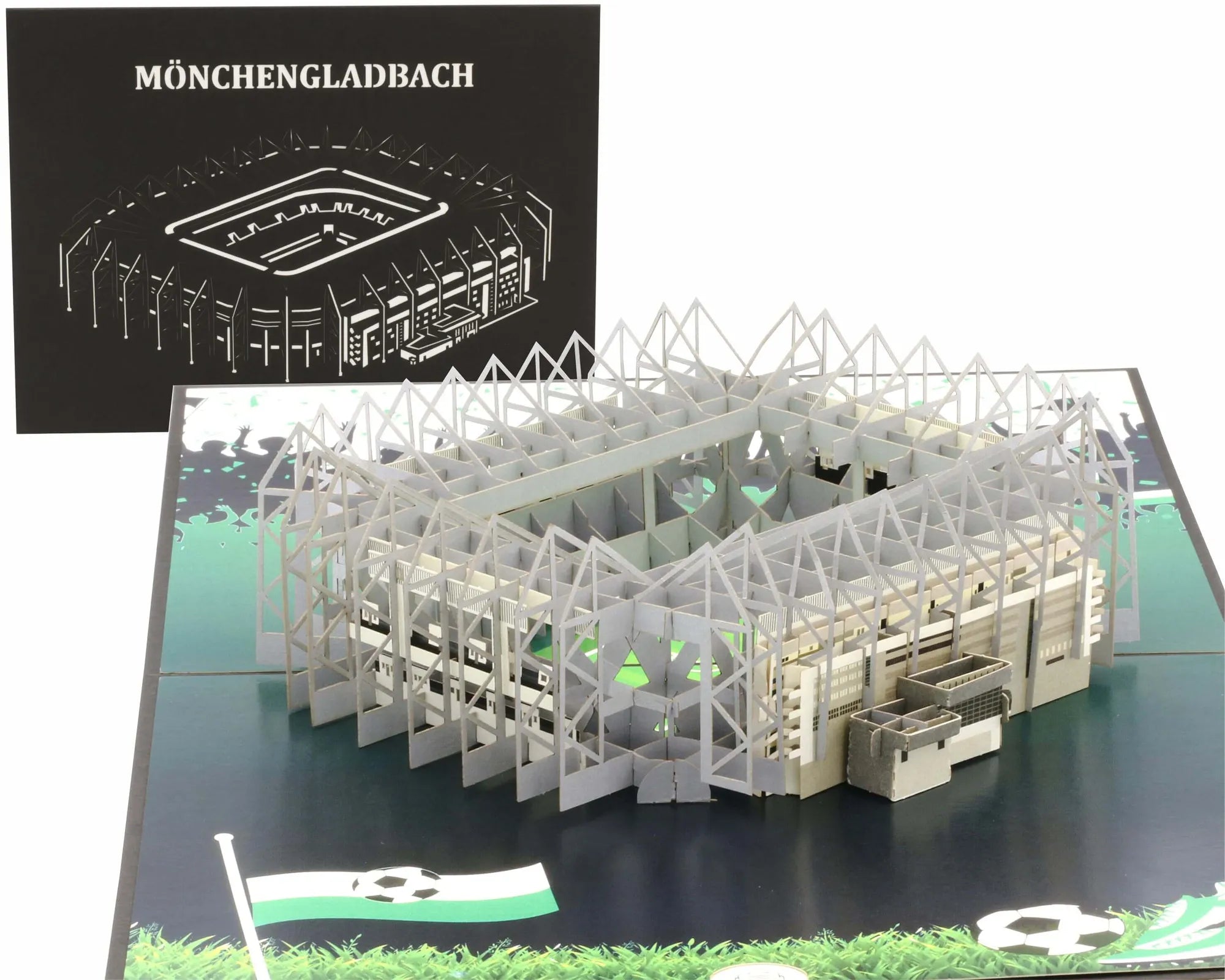 pop up karte Fußballstadions mit aufgeklappten Tribünen und angedeutetem Spielfeld, im Hintergrund ist eine schwarze Karte mit Lasercut MÖNCHENGLADBACH.