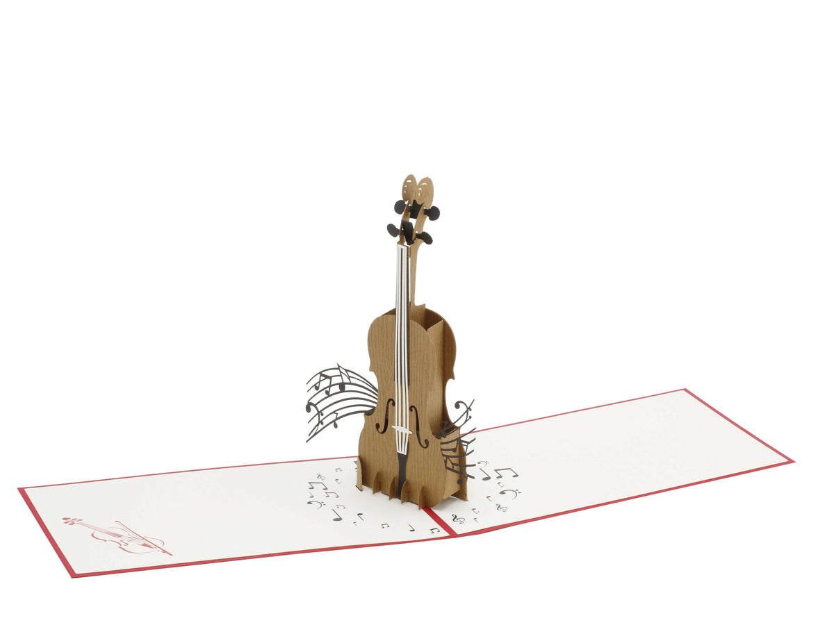 Aufgeklappte Pop-up-Karte mit Cello und schwebenden Noten, schräg von der Seite fotografiert.