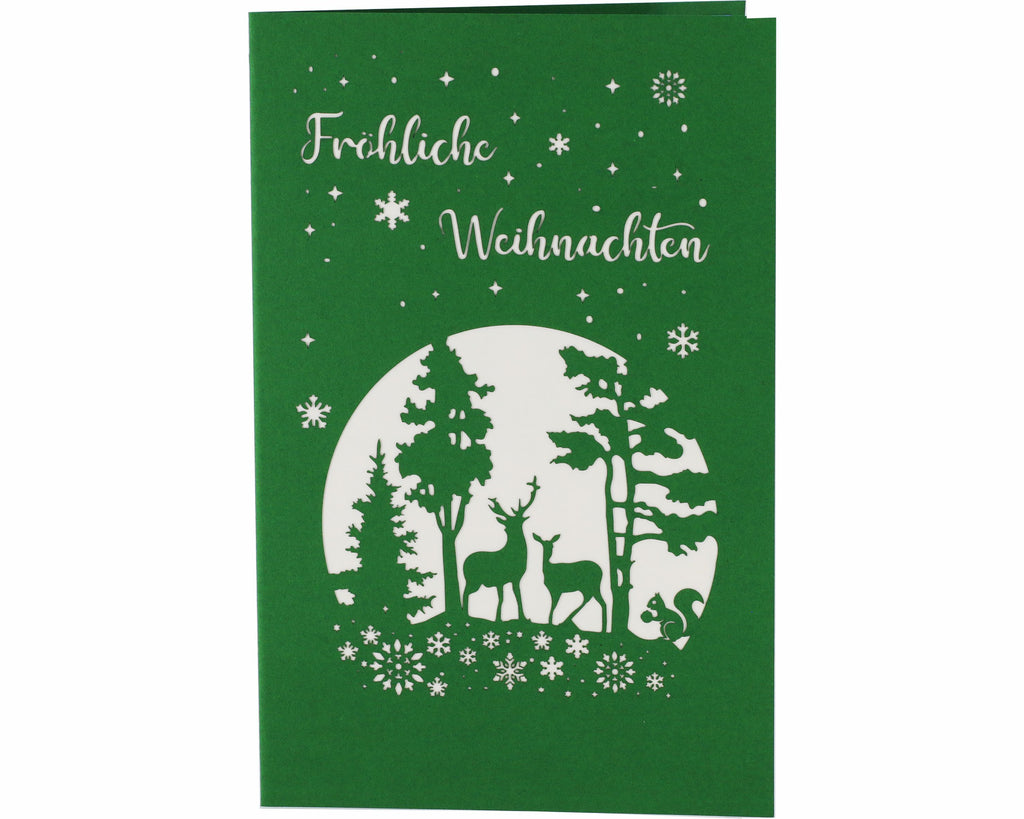 grüne karte mit fröhliche weihnachten, einer winterlandschaft, Hirsch und reh