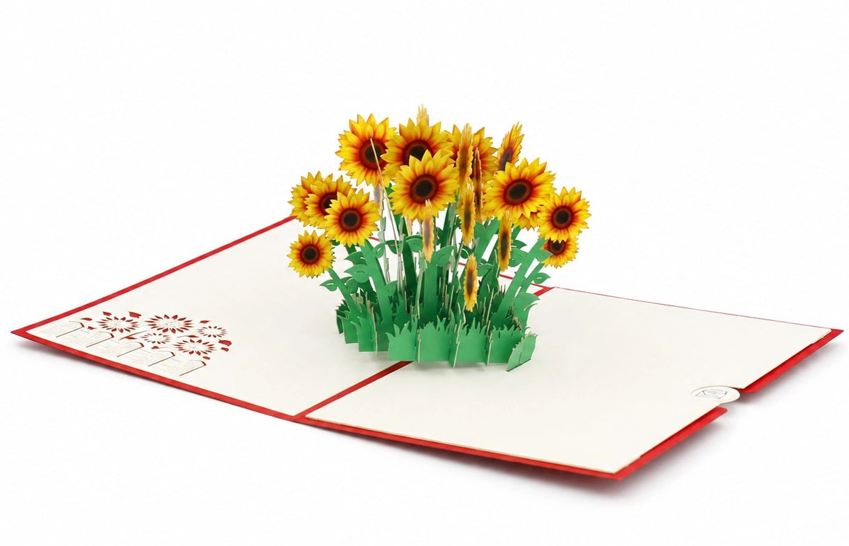 Aufgeklappte Pop-up-Karte mit rotem Rand und einem Strauß gelber Sonnenblumen.