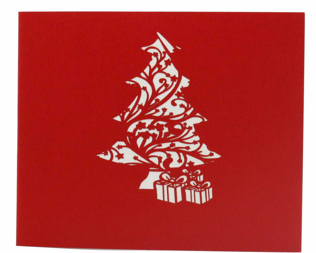 Rote karte mit filigranem Tannenbaum im Scherenschnitt