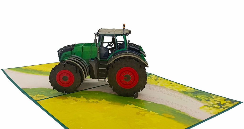 pop up karte grüner traktor mit roten felgen auf dem acker