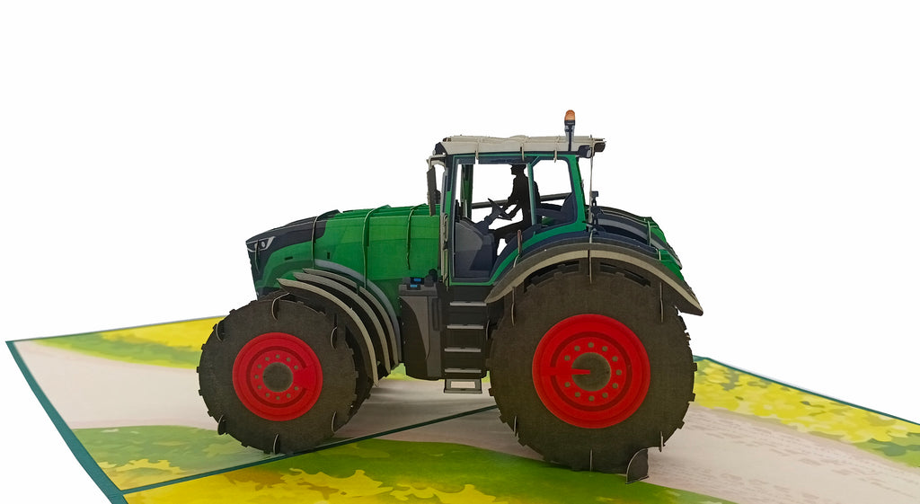 pop up karte grüner traktor mit roten felgen auf dem acker