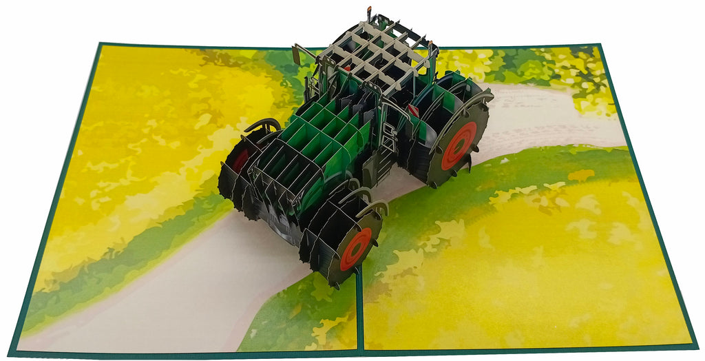 pop up karte grüner traktor mit roten felgen auf dem acker
