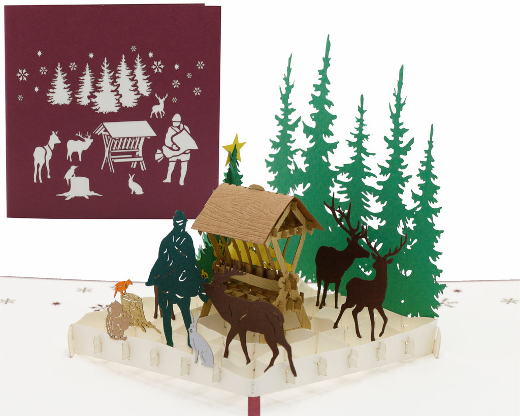 pop up karte futterkrippe im wald mit jäger und tieren