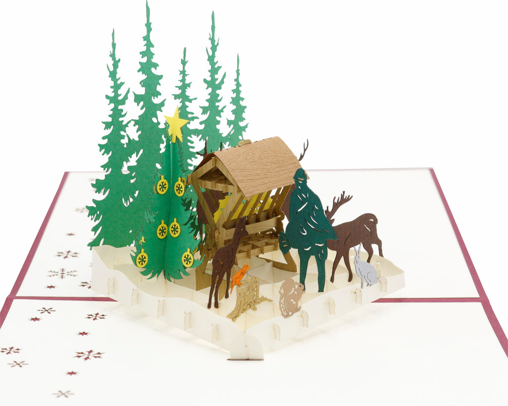 pop up karte futterkrippe im wald mit jäger und tieren