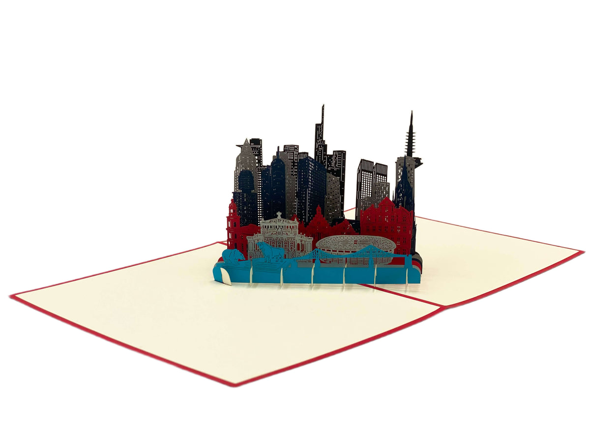 Aufgeklappte Pop-up-Karte mit der Frankfurter Skyline, schräg von der Seite fotografiert.