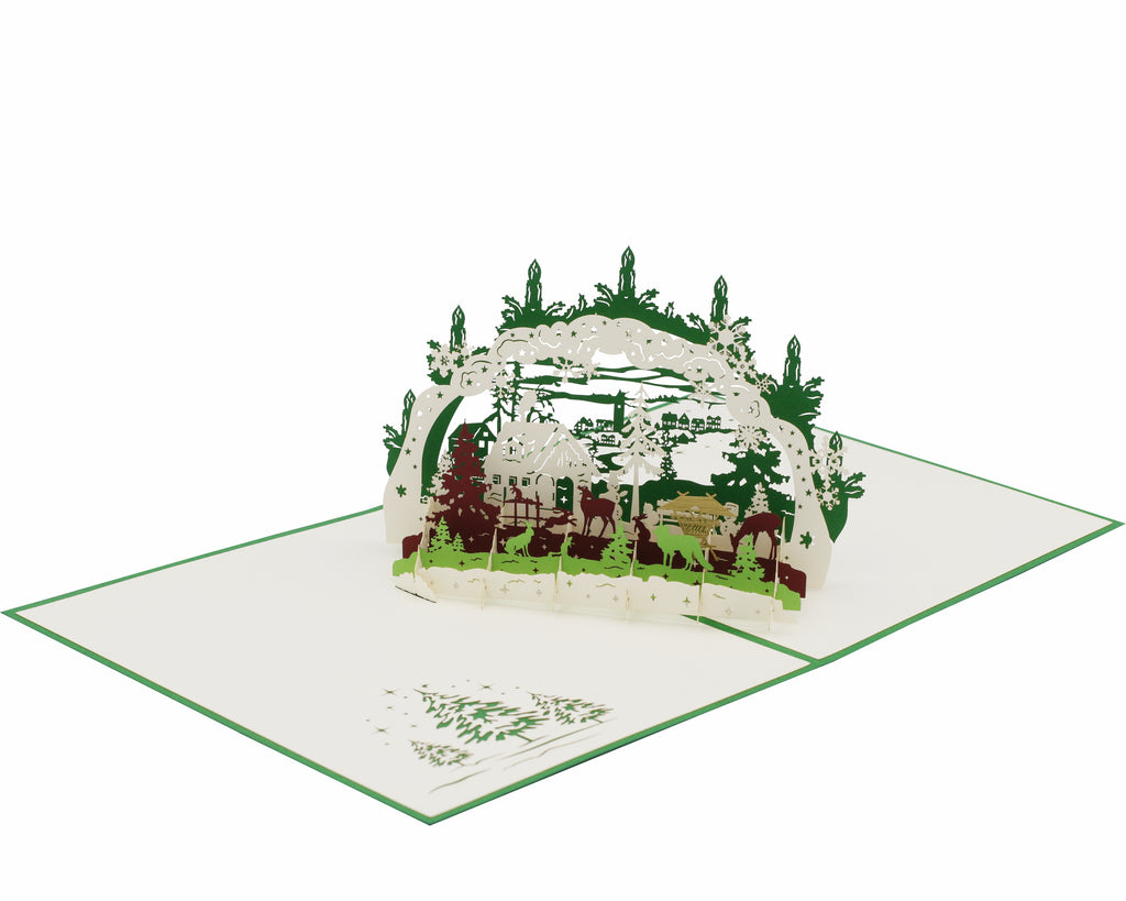 Klappkarte schwibbogen mit einer winterlandschaft, futterkrippe und tieren