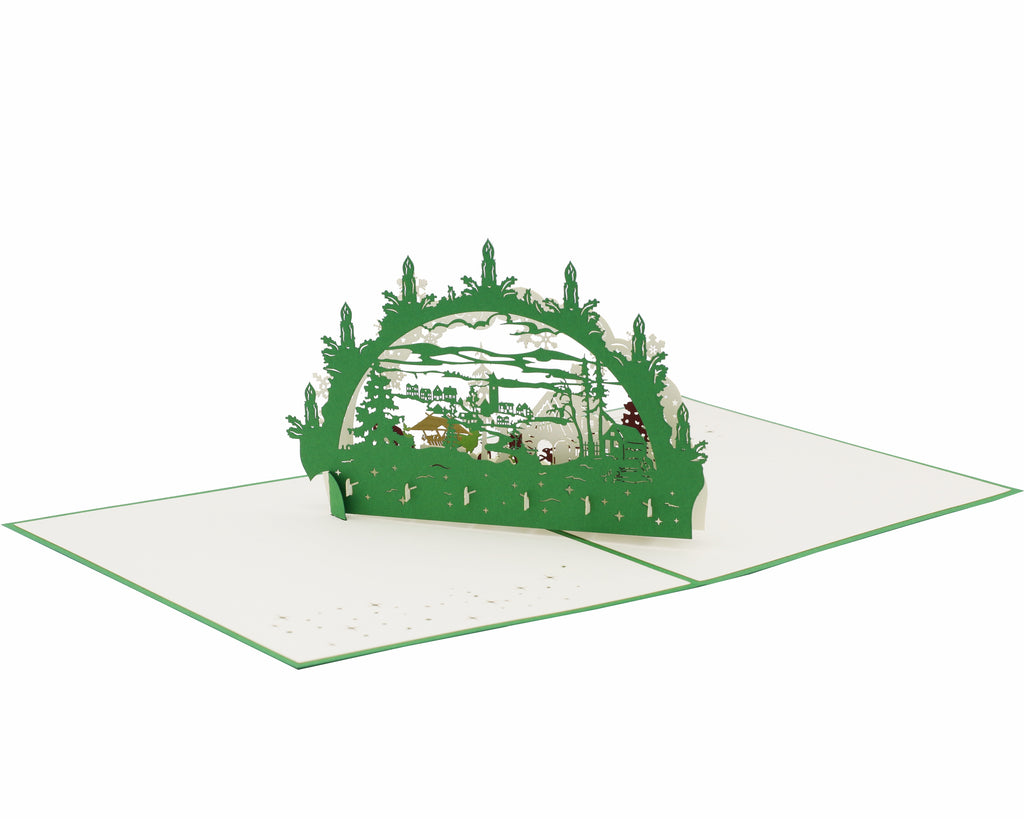 grüne pop up karte schwibbogen mit einer winterlandschaft, futterkrippe und tieren