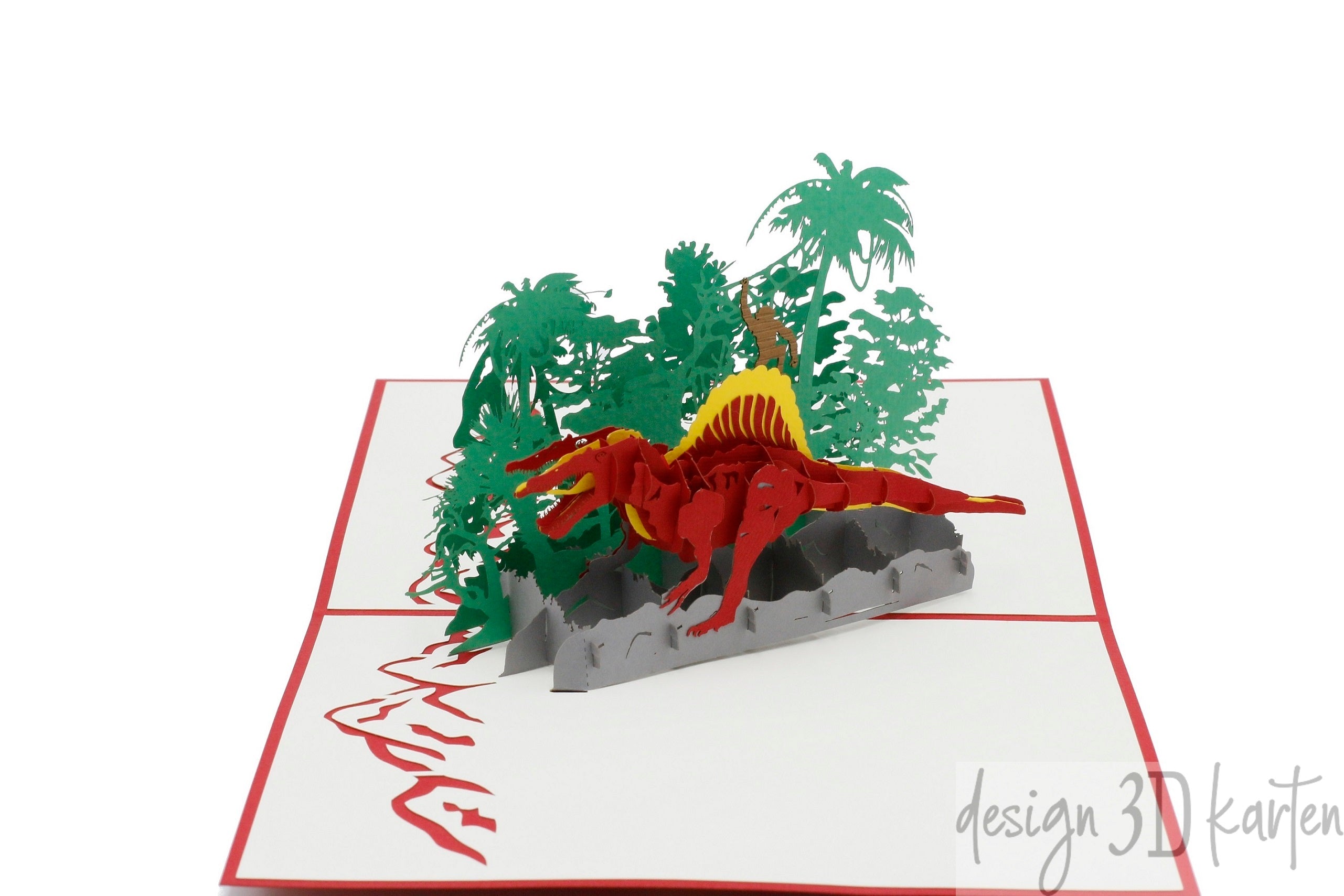 Aufgeklappte Pop-up-Karte mit rotem Rand: ein roter Dinosaurier mit gelbem Rückenkamm in einer grünen Dschungellandschaft.