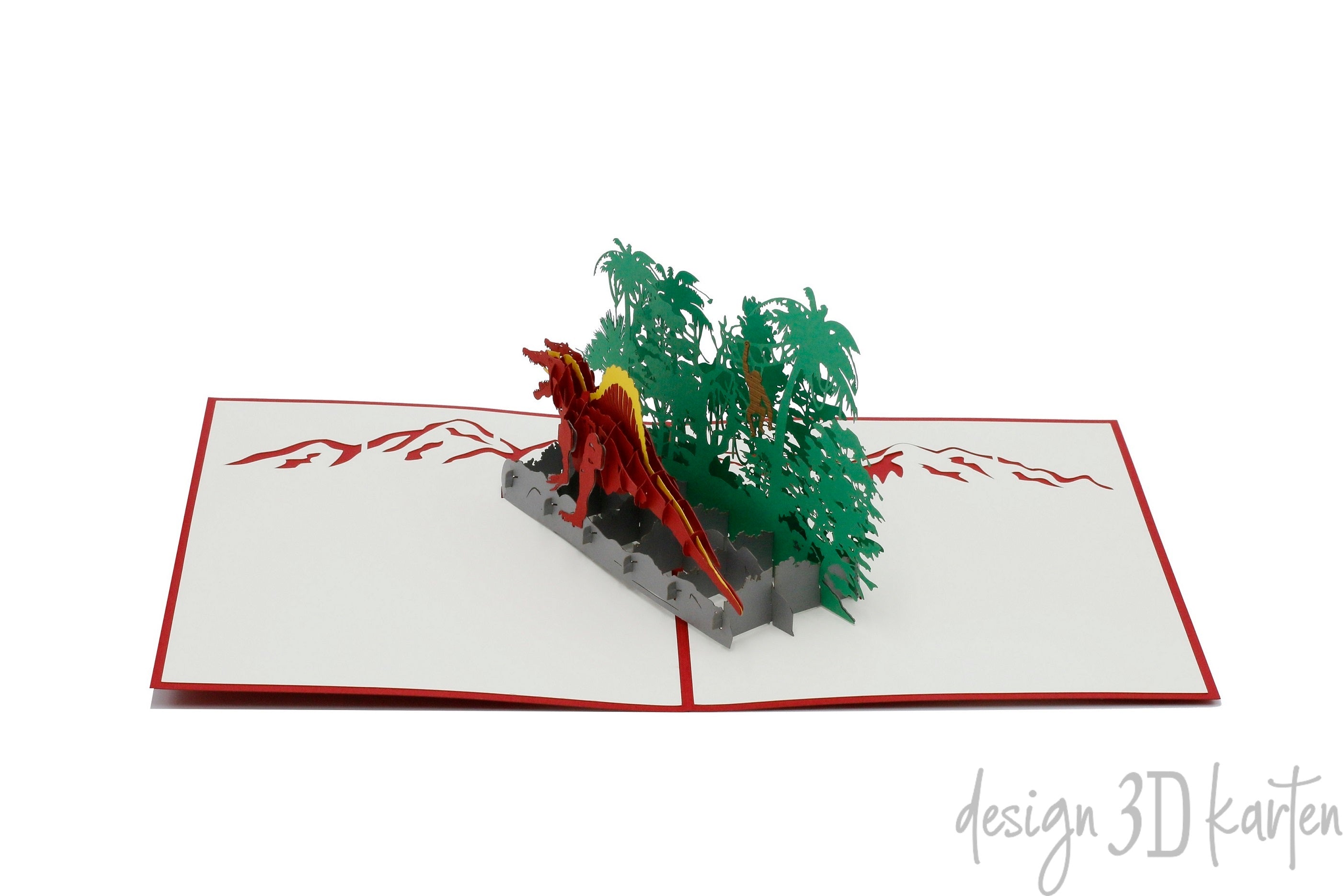Aufgeklappte Pop-up-Karte mit Dinosaurier und Dschungel, frontal fotografiert.