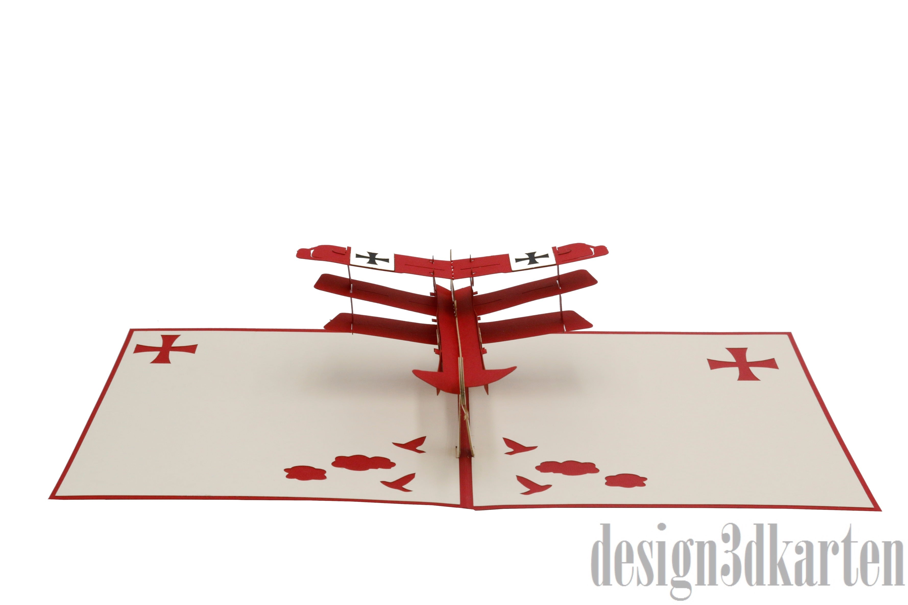 Aufgeklappte Pop-up-Karte mit rotem Flugzeug aus Papier, frontal von vorne fotografiert.