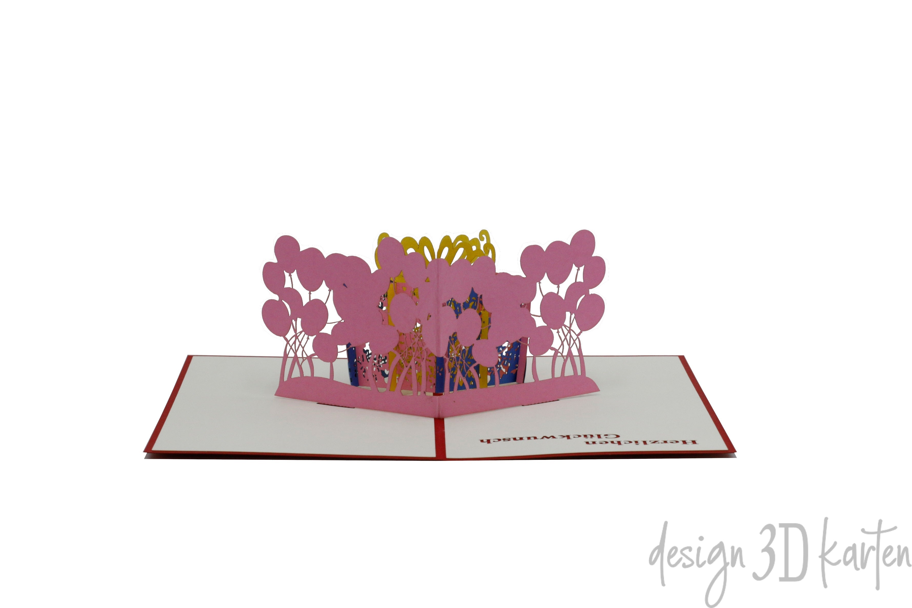 Aufgeklappte Pop-up-Karte mit rosa Geschenkbox und Luftballons, frontal fotografiert.