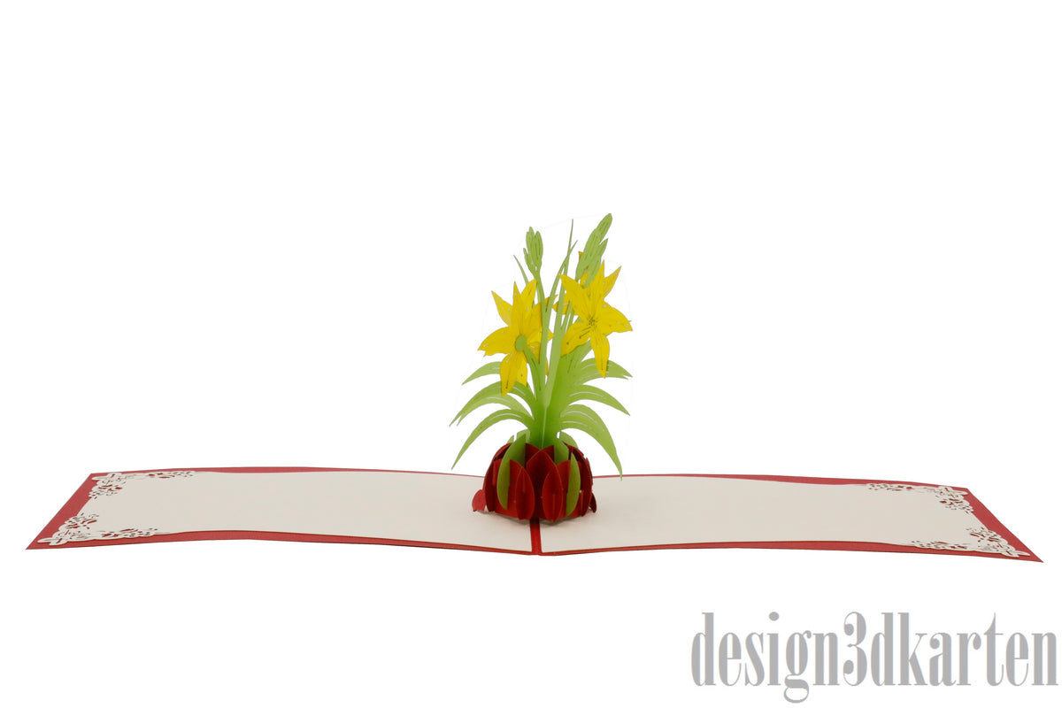 Aufgeklappte Pop-up-Karte mit gelben Lilien in einer Vase, flach von vorne fotografiert.