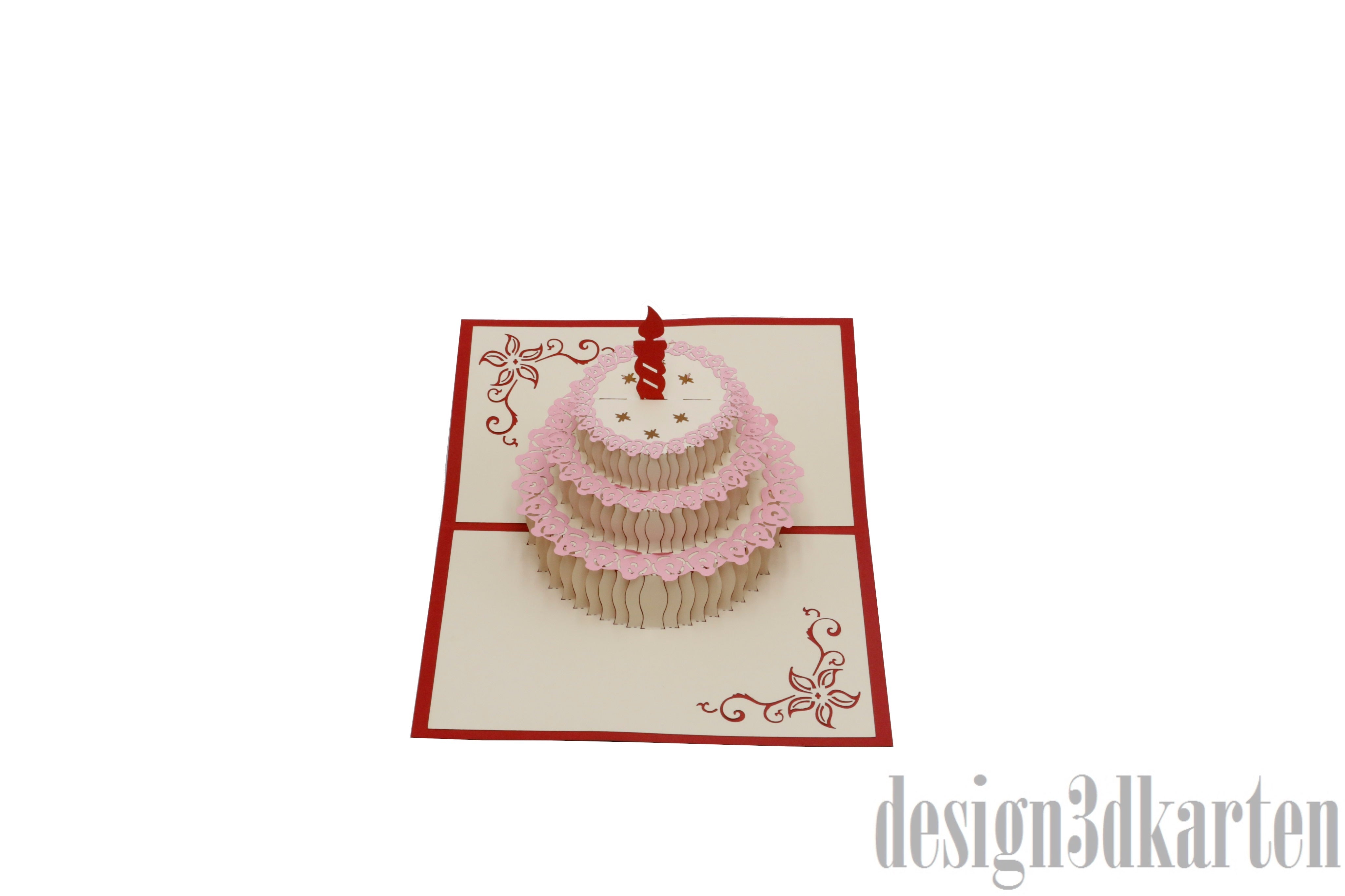 Aufgeklappte Pop-up-Karte mit einer Torte mit roter Kerze und rosa Spitzendekor.