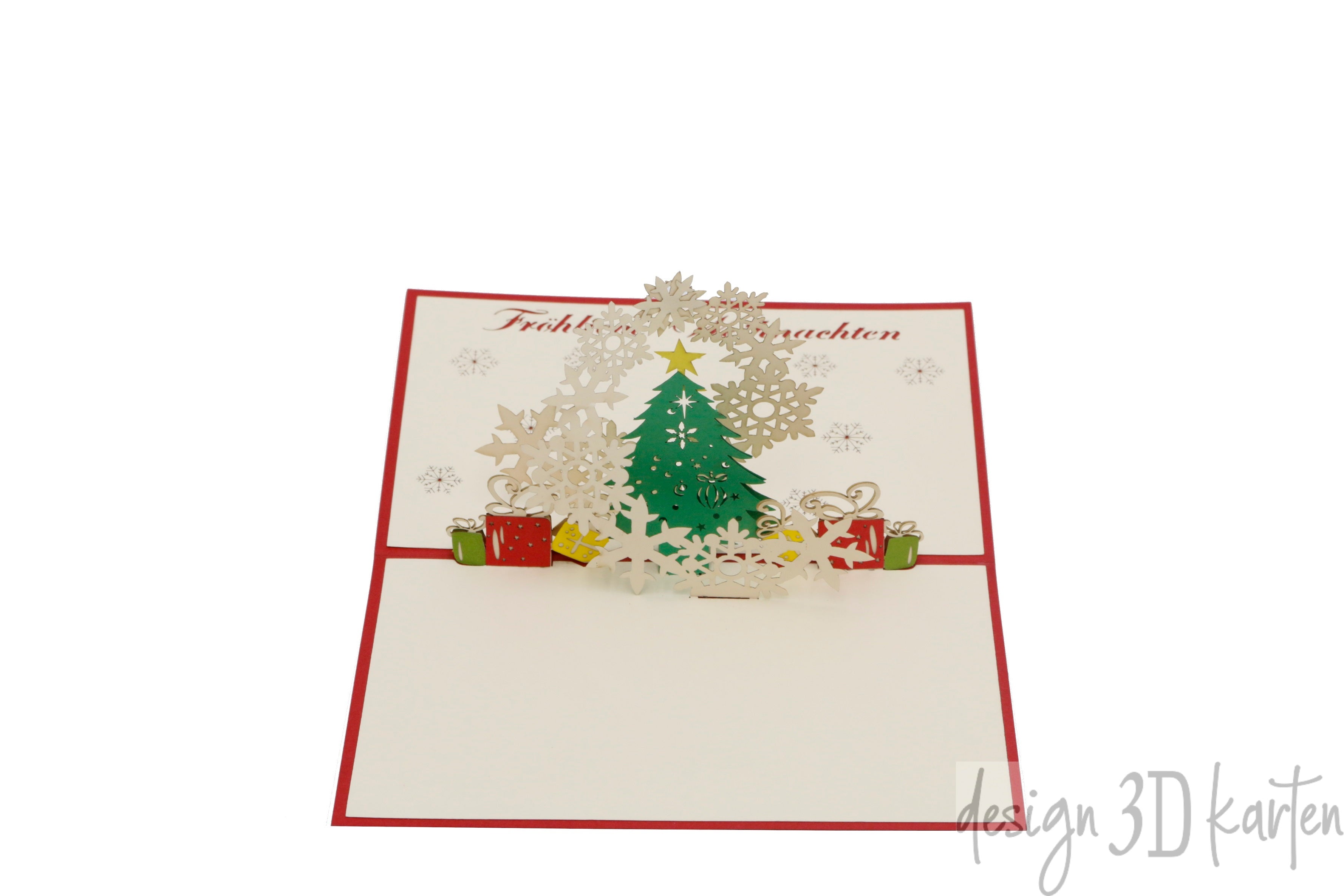 Aufgeklappte Pop-up-Karte mit einem grünen Weihnachtsbaum, Geschenken und Schneeflocken, darüber der Schriftzug Fröhliche Weihnachten.