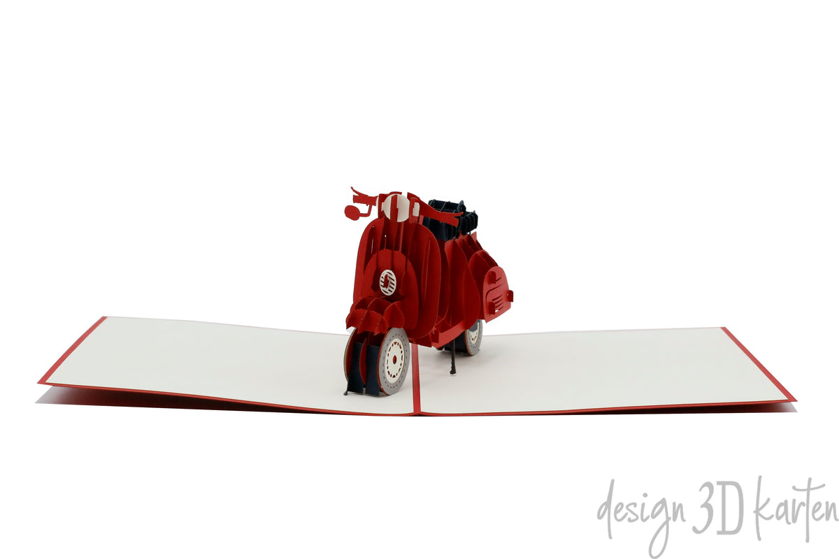 Aufgeklappte Pop-up-Karte mit roter Vespa, frontal von vorne fotografiert.