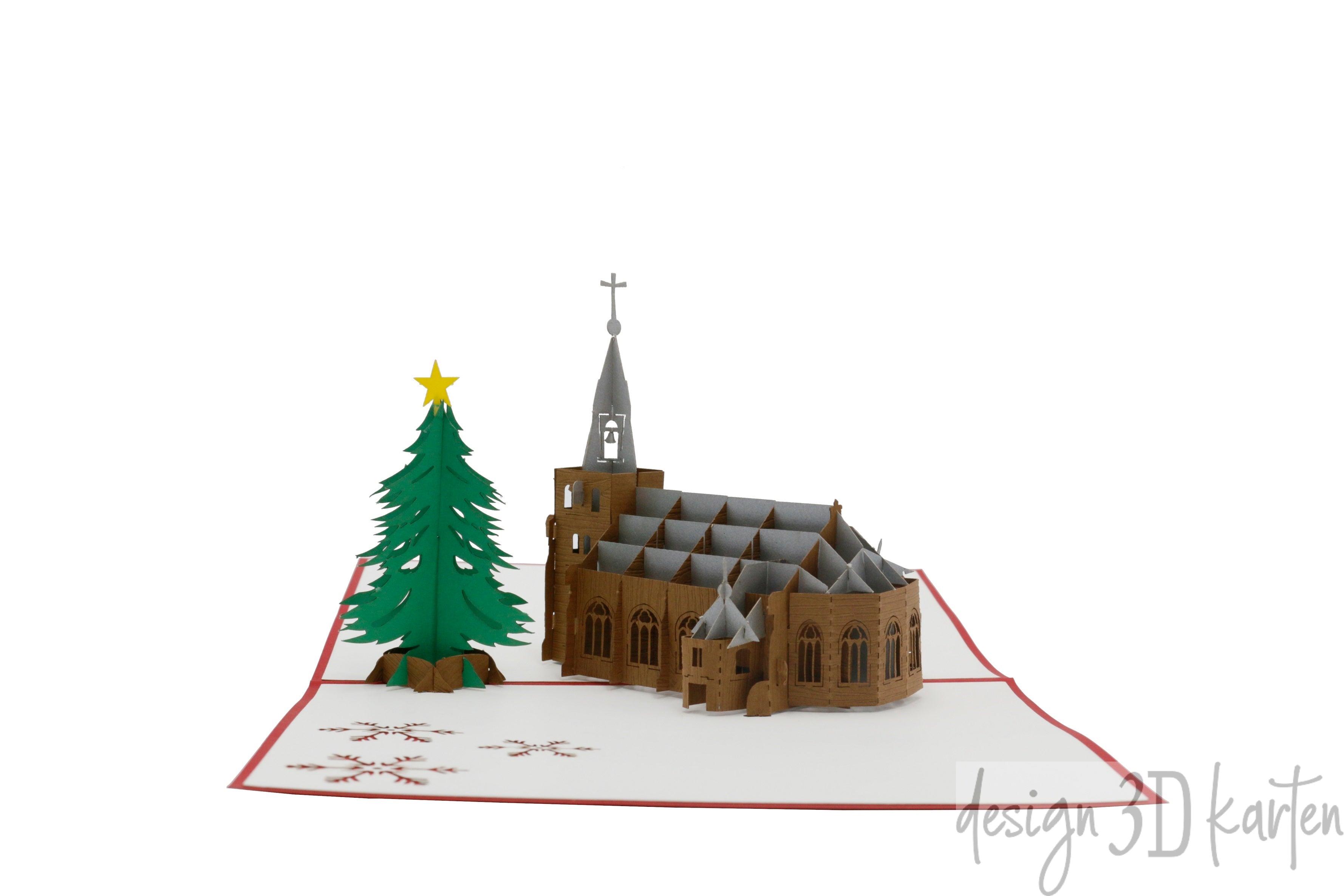 Aufgeklappte Pop-up-Karte mit rotem Rand: eine winterliche Kirche mit Turm und ein geschmückter Tannenbaum.
