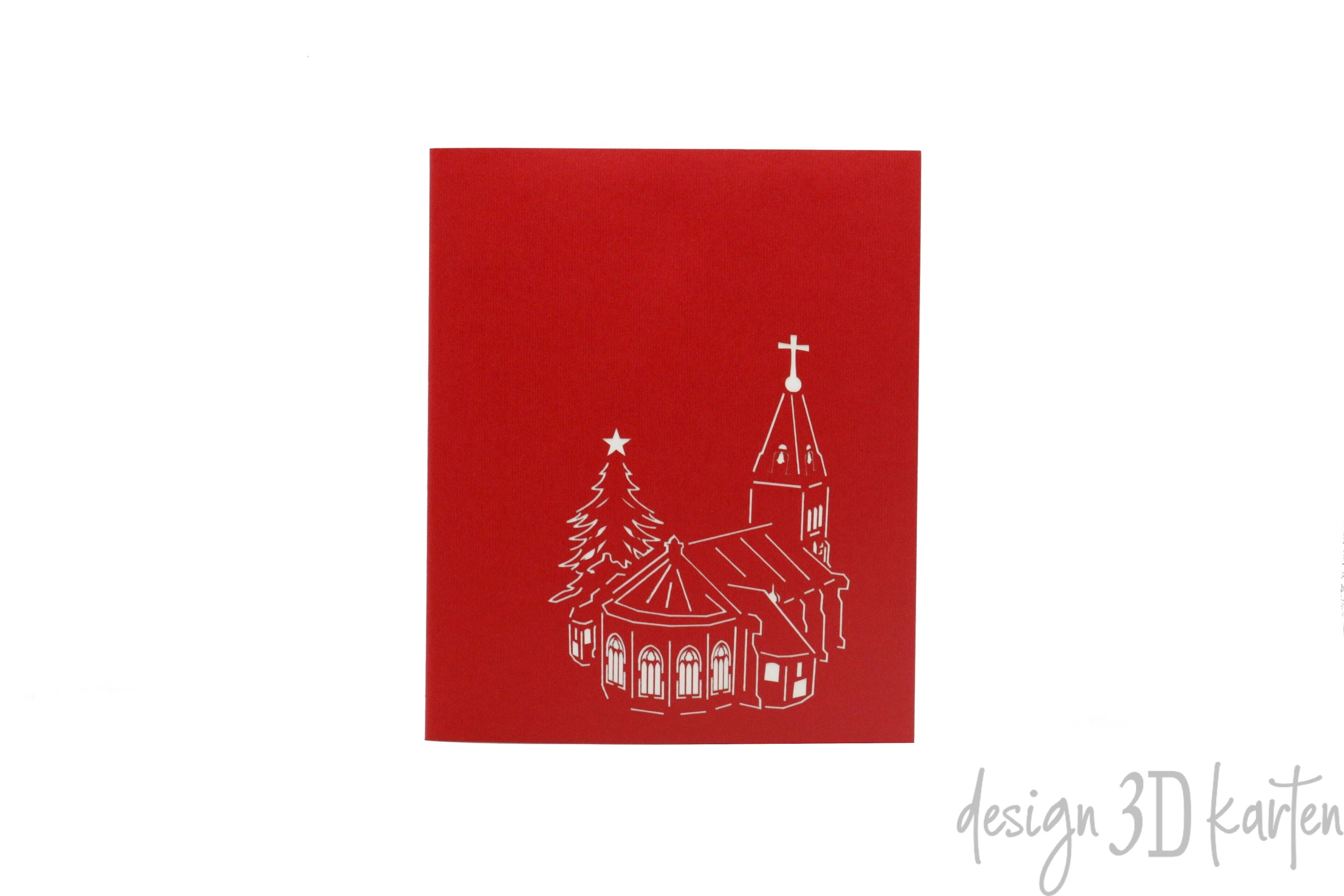 Rote Kartenvorderseite mit einer Kirche und einem Tannenbaum als Scherenschnitt.