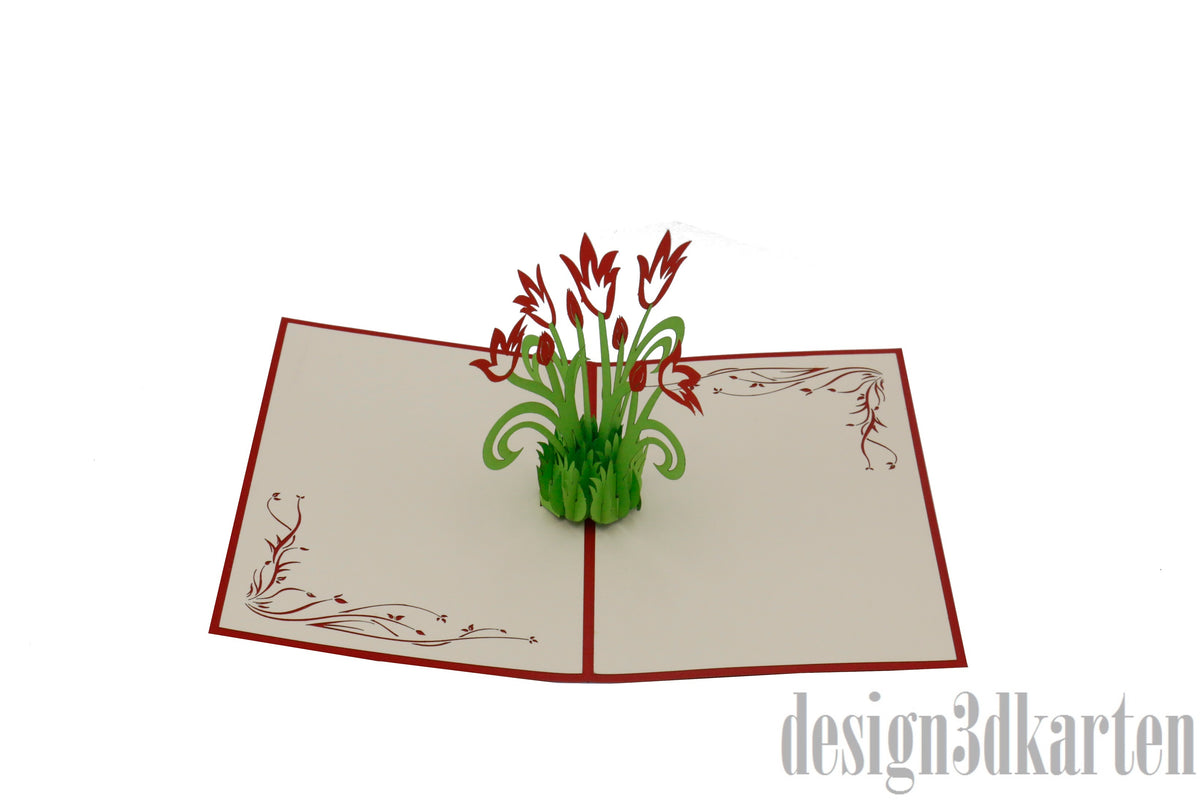 Aufgeklappte Pop-up-Karte mit rotem Rand und einem Strauß roter Tulpen mit grünen Blättern.