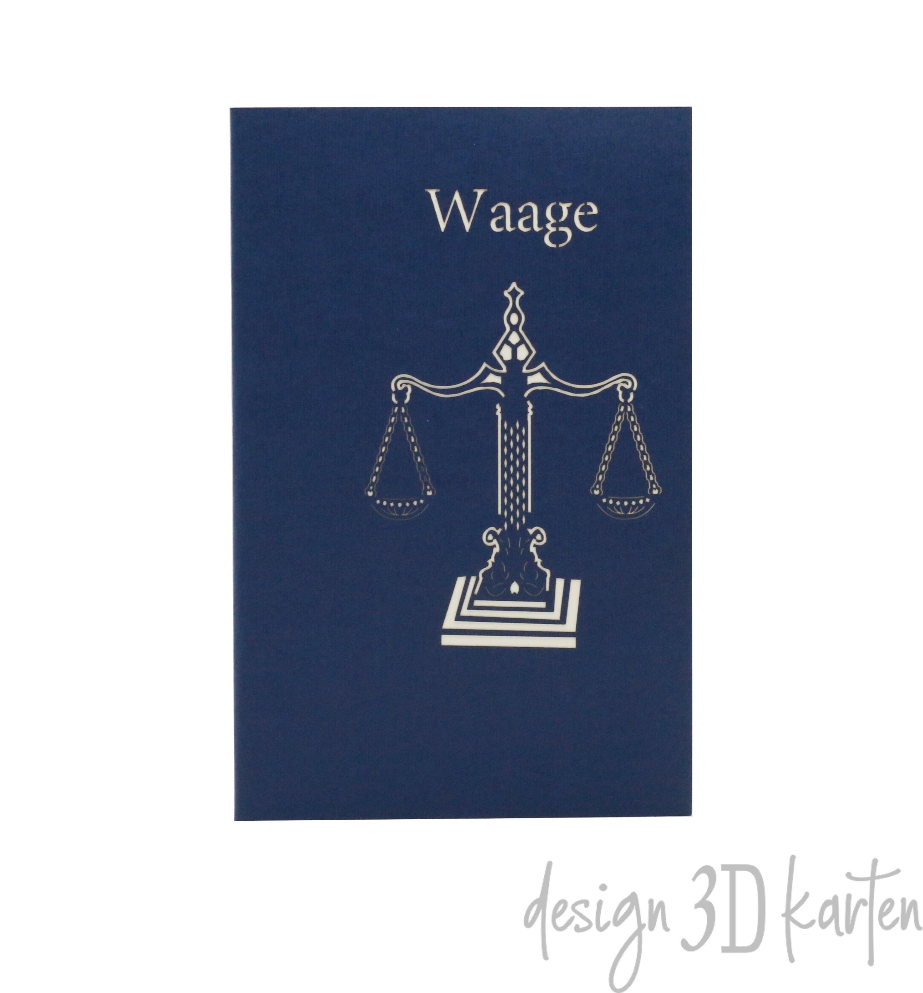 Dunkelblaue Kartenvorderseite mit einer Waage als Scherenschnitt und dem Schriftzug Waage.